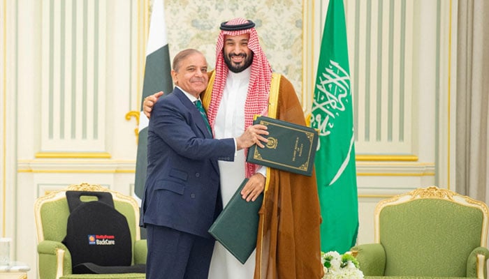 Prime Minister Shehbaz Sharif and Saudi Crown Prince Mohammed bin Salman embrace each other on the day they sign a defence agreement, in Riyadh, Saudi Arabia, September 17, 2025. — Reuters