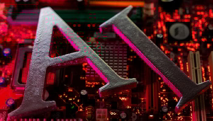 AI (Artificial Intelligence) letters are placed on computer motherboard in this illustration taken, June 23, 2023. — Reuters