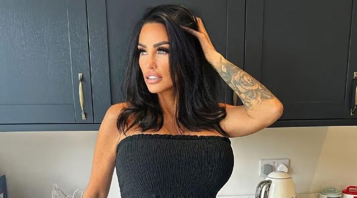 Katie Price flashes big smile as she video calls Lee Andrews during Rome trip