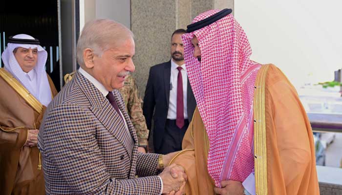 Prime Minister Shehbaz Sharif is being received by Prince Saud bin Mashaal bin Abdulaziz at the royal terminal of Jeddah International airport on March 12, 2026. — PMO