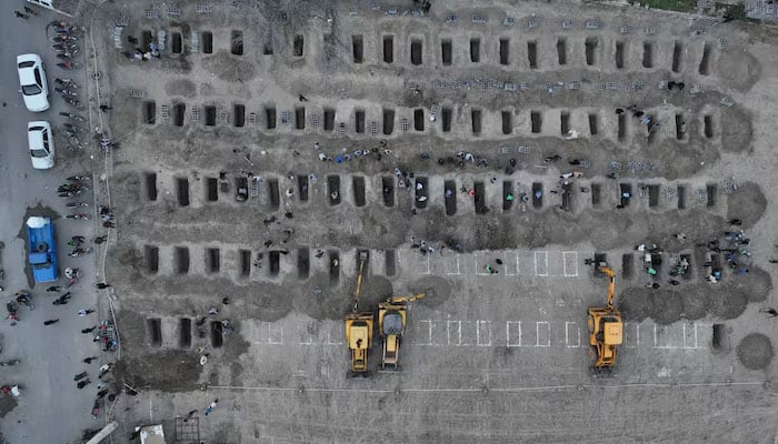 Graves being prepared for the victims in Irans Minab on March 2, 2026. — Reuters