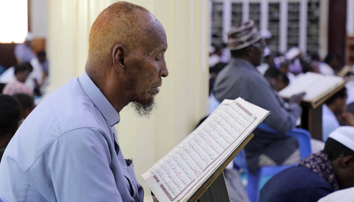 A Muslim man recites the Quran during Ramadan at the Omar ibn al-Khattab Mosque in Hodan district of Mogadishu, Somalia, March 6, 2026. — Reuters