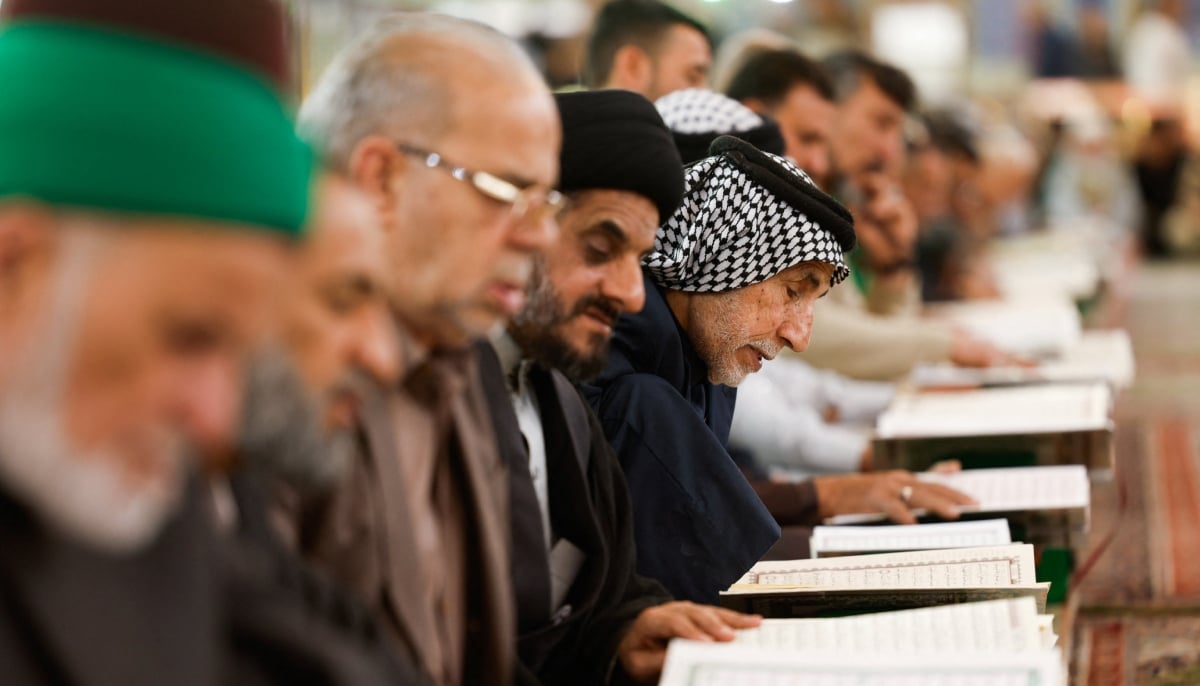 People recite the Holy Quran during the month of Ramadan at the Imam Hussein shrine in Karbala, Iraq, February 24, 2026. — Reuters