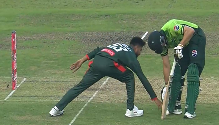 Bangladesh skipper Mehidy Hasan Miraz (left) attempts to run out while Salman Agha stands outside the crease during the second ODI match against Pakistan here at the Sher-e-Bangla National Cricket Stadium in Dhaka on March 12, 2026. — Screengrab/X/@BCBtigers