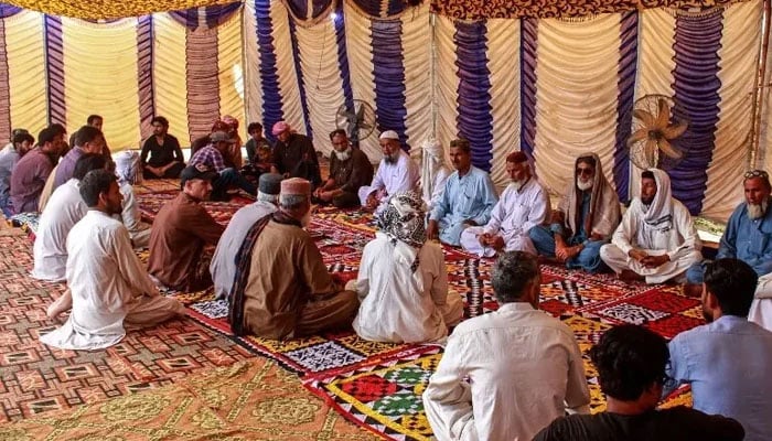 Mourners gather to offer condolences after the death of Pakistani national Muzaffar Ali, who was killed in Dubai amid the ongoing Middle East war, after his funeral in Jamshoro, Sindh, on March 12, 2026. — AFP