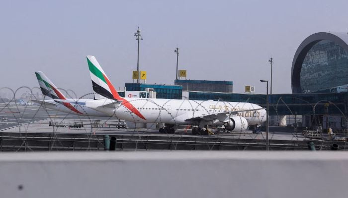 Planes are parked at Terminal 3 of the Dubai International Airport, following the United States and Israel strikes on Iran, in Dubai, United Arab Emirates, March 2, 2026. — Reuters