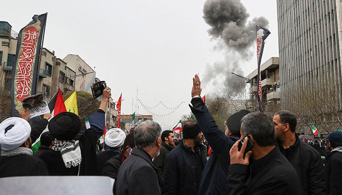 Smoke rises following an explosion during a protest marking the annual al-Quds Day in Tehran, Iran on March 13, 2026. — Reuters