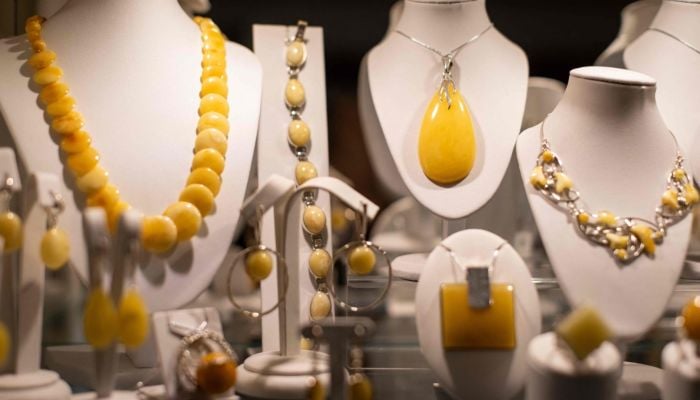 This photo shows jewellery made from natural Baltic amber, on sale at an amber shop on Mariacka Street in Gdansk, Poland, on March 10, 2026. — AFP