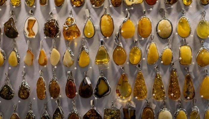 This photo shows jewellery made from natural Baltic amber, on sale at an amber shop on Mariacka Street in Gdansk, Poland, on March 10, 2026. — AFP