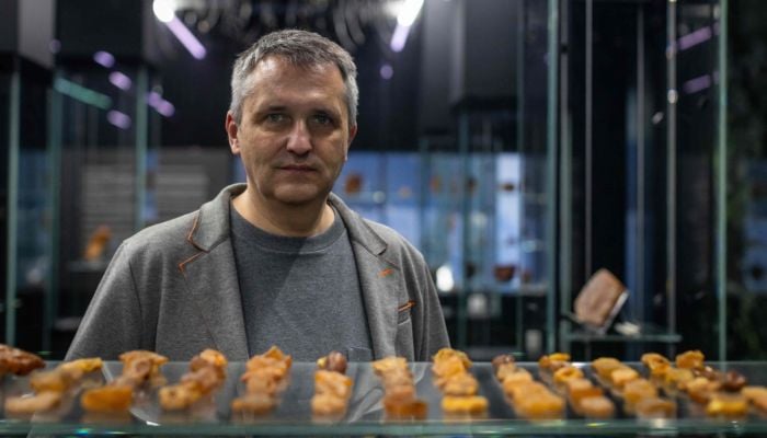 Professor and jewellery designer Slawomir Fijalkowski, head of the Experimental Design Studio at the Academy of Fine Arts in Gdansk, poses for the pictures at the Amber Museum in Gdansk, Poland, on March 10, 2026. — AFP