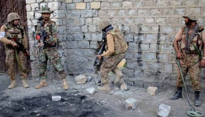 In this file photo, security forces are seen taking position during an operation. — ISPR/File