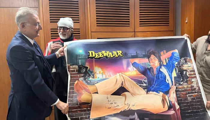 This image shows Anil Dhanak with Amitabh Bachchan. — Reporter