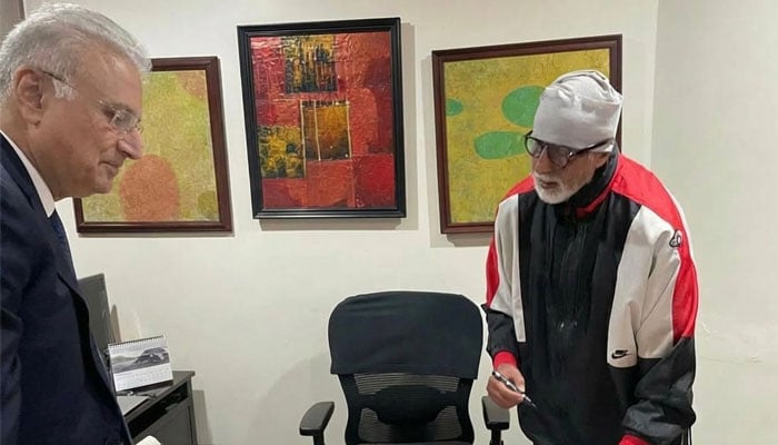 This image shows Anil Dhanak with Amitabh Bachchan. — Reporter