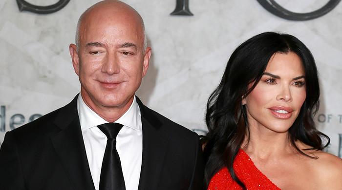 Lauren Sánchez shoos away Jeff Bezos on Vanity Fair Oscars red carpet