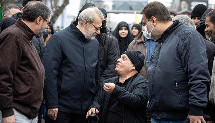 Iranian security chief Ali Larijani takes part in a pro-government rally in Tehran, Iran, March 13, 2026. — Reuters