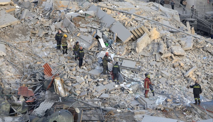 Emergency personnel work at the site of a collapsed building, in the aftermath of an Israeli strike in central Beiruts Bachoura neighbourhood, following an escalation between Hezbollah and Israel amid the US-Israeli conflict with Iran, Lebanon, March 18, 2026. — Reuters