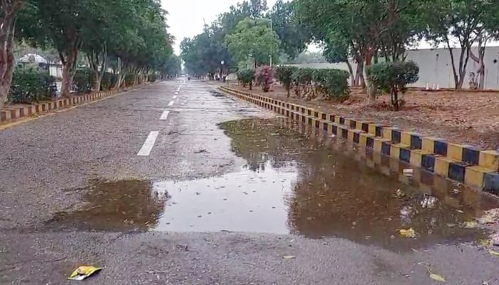 Rainwater forms a puddle on roadside in Karachi after heavy rain on March 19, 2026. — Geo News