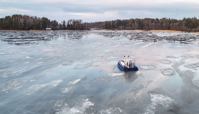 An hovercraft used also to bring home kids from school, glides on the ice of the Finnish archipelago on March 3, 2026 in Pargas, Finland. — AFP