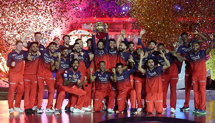 Royal Challengers Bengaluru players celebrate with the trophy after winning the Indian Premier League, June 4, 2025. — Reuters