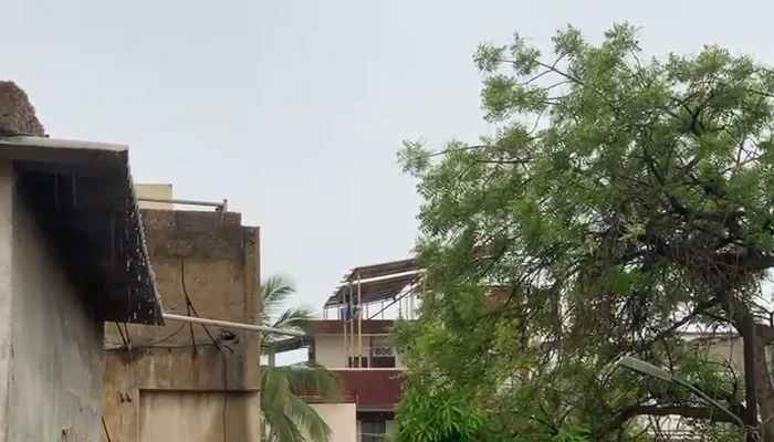Rainwater pours from a house after a thunderstorm accompanied by gale-force winds on March 19, 2026. — Geo News