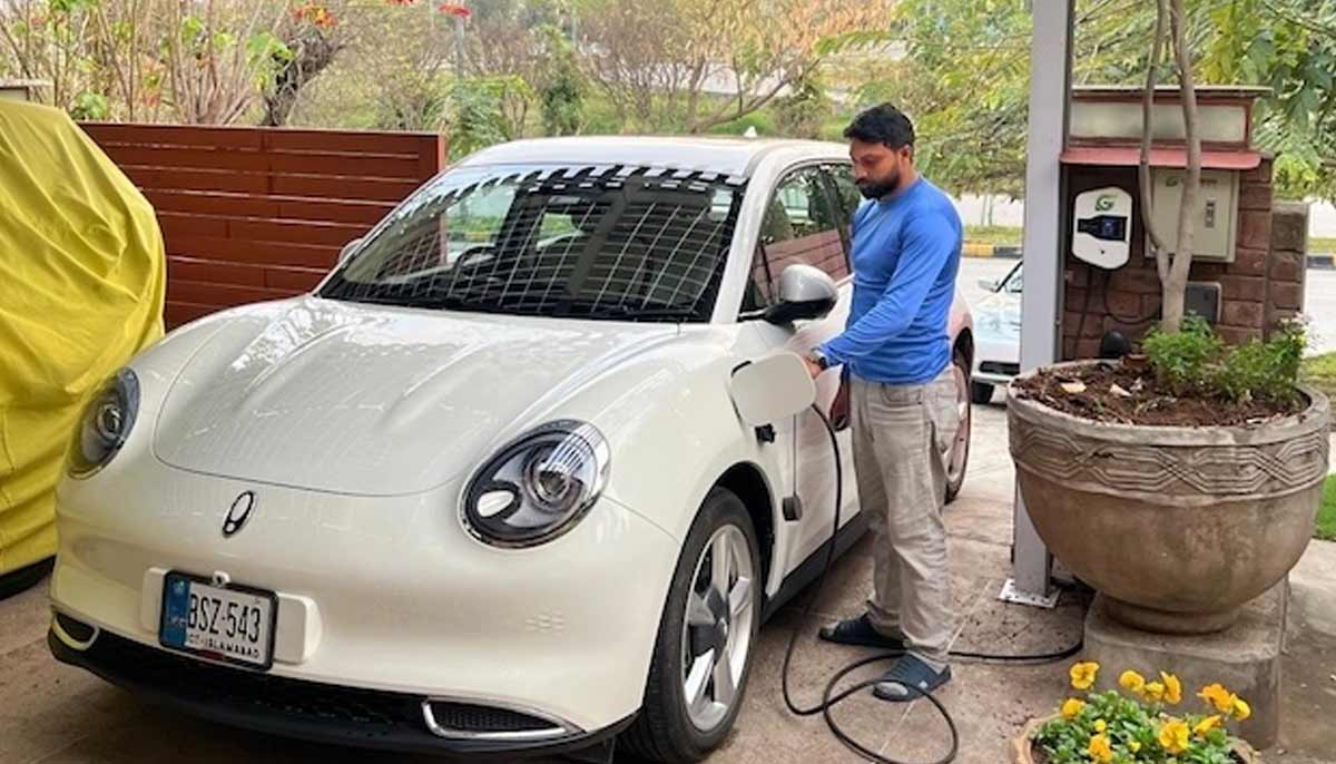 Vaqar Zakaria’s white EV charges under rooftop solar panels at his home — powered by the sun.— Vaqar Zakaria