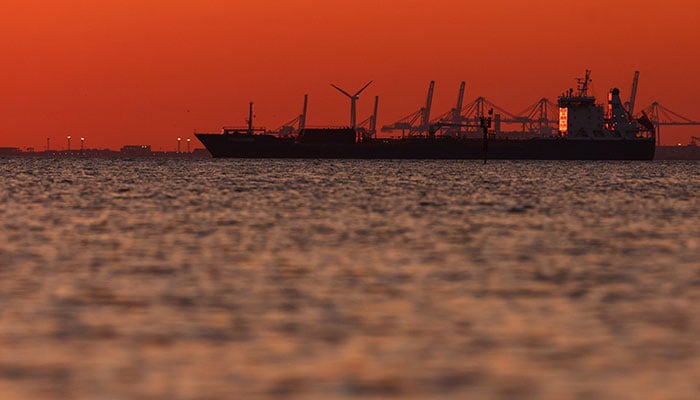 The silhouette of an oil and chemical tanker off the Gulf of Fos-sur-Mer at sunset, in Martigues, France, March 20, 2026. — Reuters