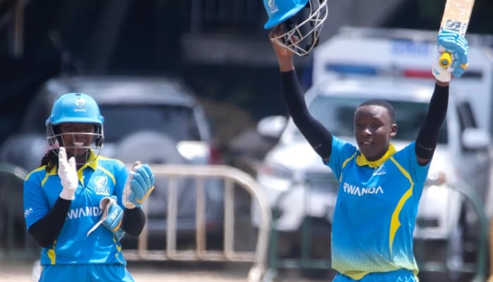 Rwandas Fanny Utagushimaninde (right) raises a bat after scoring an unbeaten century against Ghana in the Nigeria Invitational Womens T20I Tournament in Lagos, Nigeria, March 20, 2026. — Nigeria Cricket Federation