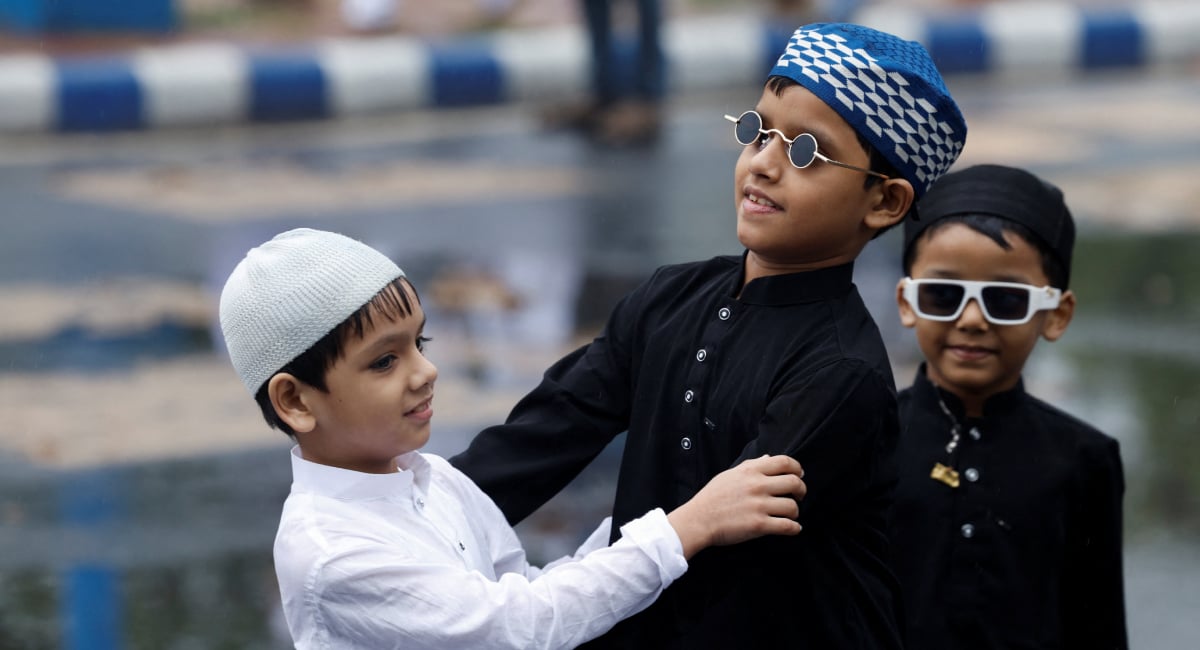 Children greet each other on the occasion of Eid al-Fitr to mark the end of the holy fasting month of Ramadan in Kolkata, India, March 21, 2026. — Reuters