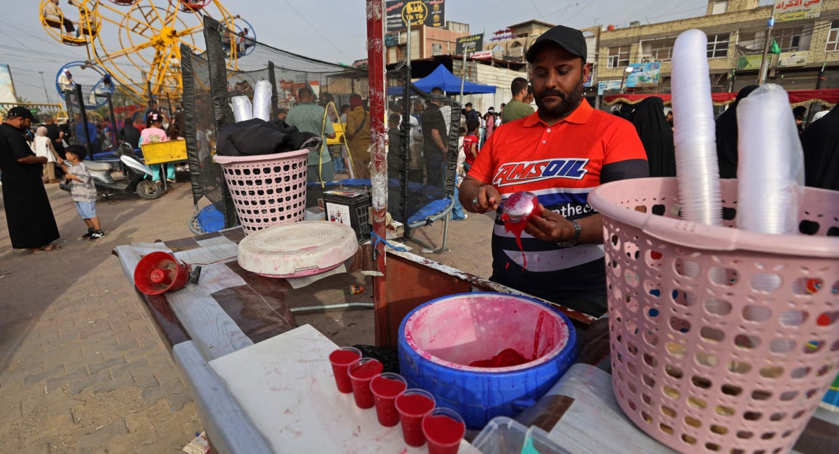 A man sells ice cream at an amusement park on Eid ul Fitr, which marks the end of the Muslim holy fasting month of Ramadan, in the eastern Sadr City, suburb of Baghdad on March 21, 2026. — AFP