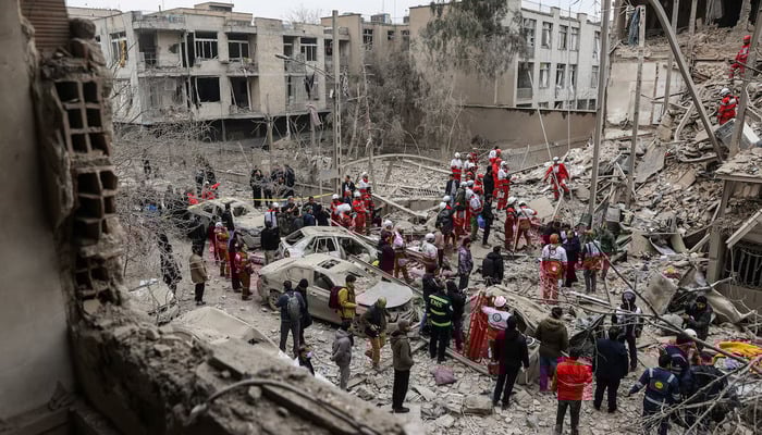 Eergency personnel work at the site of a strike on a residential building, amid the US-Israeli conflict with Iran, in Tehran, Iran, March 16, 2026. — Instagram