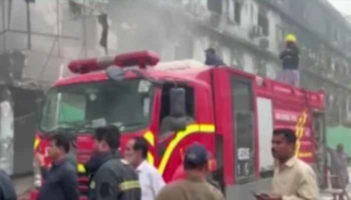 Firefighters work to douse flames following a fire at Gul Plaza in Karachi, March 22, 2026. — Screengrab via YouTube/Geo News