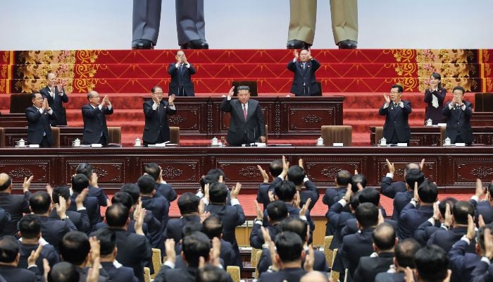 This picture, taken on March 22, 2026 and released by North Koreas official Korean Central News Agency (KCNA) on March 23, 2026, shows North Korean leader Kim Jong Un (C) attending the First Session of the 15th Supreme Peoples Assembly at Mansudae Assembly Hall in Pyongyang. — AFP