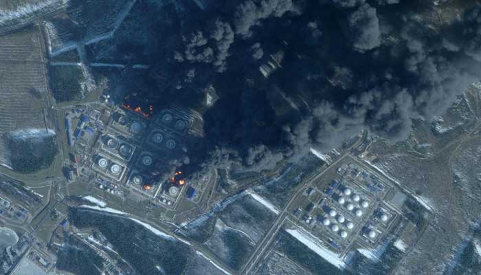 This handout satellite image taken on March 23, 2026 by Planet Labs PBC shows smoke rising from the Russian oil terminal at Primorsk, the most important Russian loading port in the Baltic Sea, following a drone attack claimed by Ukraine on March 23, 2026. — AFP
