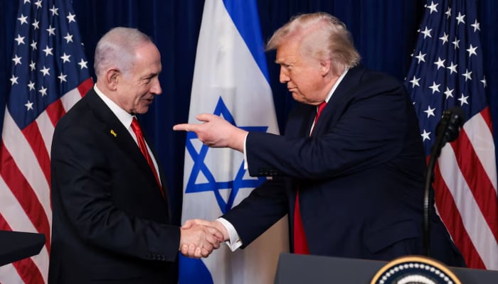 US President Donald Trump points his finger towards Israeli Prime Minister Benjamin Netanyahu as they shake hands during a press conference after meeting at Trump’s Mar-a-Lago club in Palm Beach, Florida, US, December 29, 2025. — Reuters