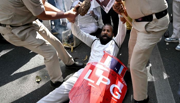 Indias Opposition Congress party workers stage a protest against the price hike and shortage of liquid petroleum gas (LPG) in New Delhi on March 13, 2026. — AFP