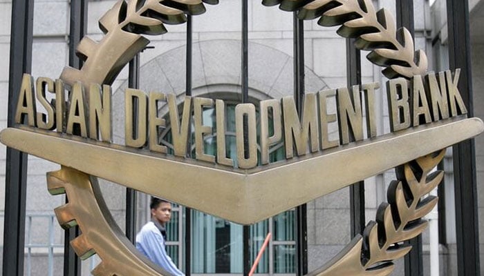 A worker walks past inside the Asian Development Bank (ADB) headquarters in Manila June 17, 2009. — Reuters