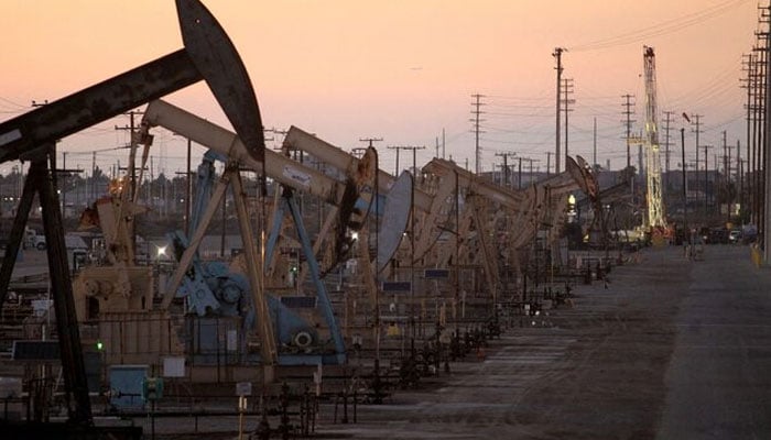 Oil rig pumpjacks, also known as thirsty birds, extract crude from the Wilmington Field oil deposits area near Long Beach, California July 30, 2013. — Reuters