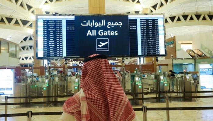 A Saudi man checks the flight timings at the King Khalid International Airport in Riyadh, Saudi Arabia, May 16, 2021. — Reuters