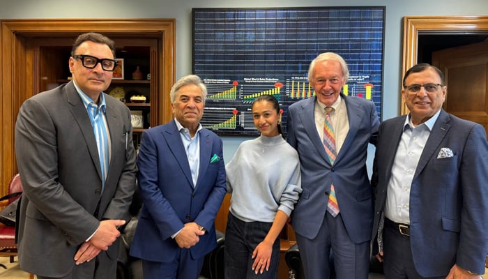 Shahid Khan (centre left), Director of the World Affairs Council Boston, poses with US lawmakers and others.