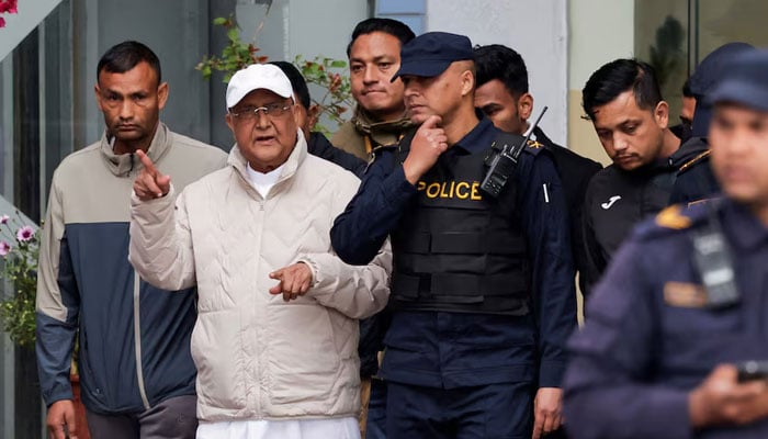 Former Nepal Prime Minister and Chairman of the Communist Party of Nepal, KP Sharma Oli gestures while being taken to a hospital from the District Police Range after his detention by police in Kathmandu, Nepal, March 28, 2026. — Reuters