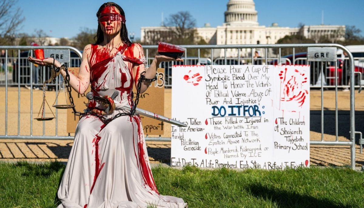 A demonstrator covered in fake blood on the National Mall, Washington, DC, US. — Reuters