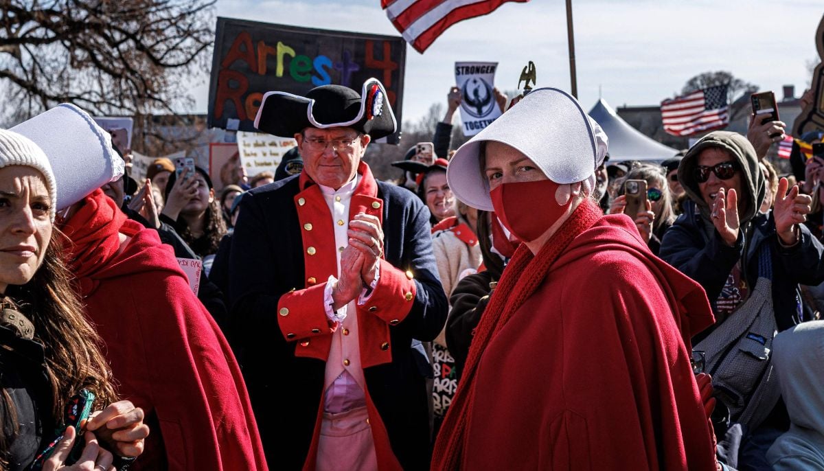 Demonstrators, including activists dressed in US Revolutionary War-era uniforms and as characters from The Handmaid´s Tale, gather during a No Kings national day of protest rally outside the Minnesota State Capitol on March 28, 2026, in St. Paul, Minnesota. — AFP