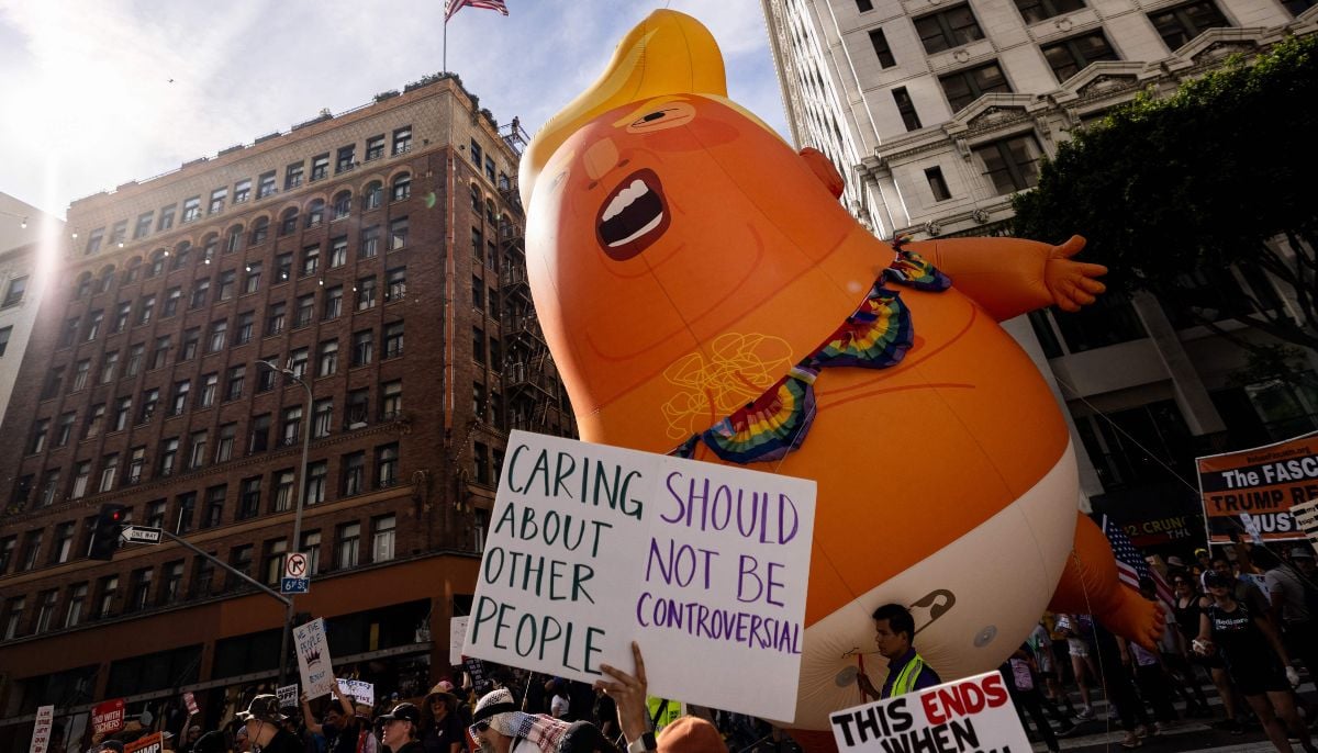 A giant inflatable balloon in the likeness of US President Donald Trump as a baby in diapers is seen as demonstrators march during the No Kings national day of protest in Los Angeles on March 28, 2026. — AFP