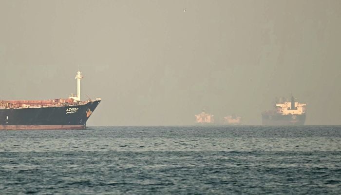 Cargo ships and tankers are seen off coast city of Fujairah, in the Strait of Hormuz in the northern Emirate, on February 25, 2026. — AFP