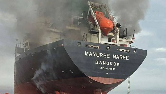 This handout photo taken on March 11, 2026 and released by the Royal Thai Navy shows smoke rising from the Thai bulk carrier ´Mayuree Naree´ near the Strait of Hormuz after an attack. — AFP