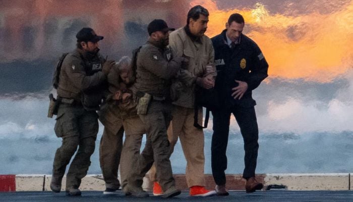 Captured Venezuelan President Nicolas Maduro and his wife Cilia Flores are escorted, as they head towards the Daniel Patrick Moynihan United States Courthouse in Manhattan for an initial appearance to face US federal charges including narco-terrorism, conspiracy, drug trafficking, money laundering and others, at Downtown Manhattan Heliport, in New York City, US, January 5, 2026. — Reuters
