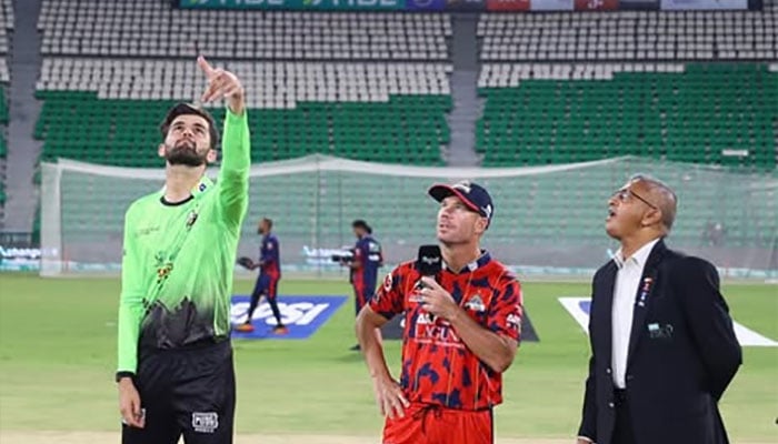 Lahore Qalandars skipper Shaheeh Shah Afridi (left) and Karachi Kings captain David Warner (centre) during the toss for the Pakistan Super League 11 match at Gaddafi Stadium, Lahore, on March 29, 2026. — PSL