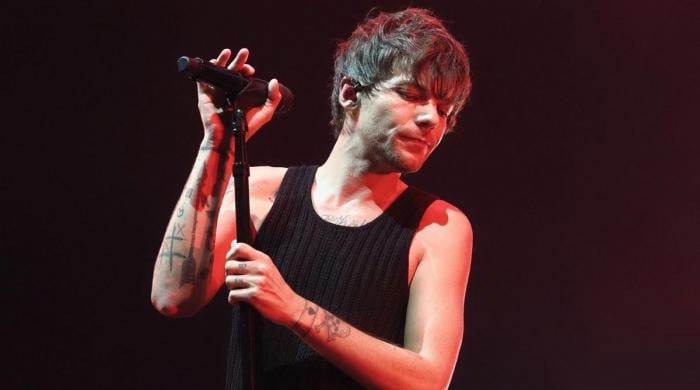 Louis Tomlinson turns heads in eye-catching red jacket at Sweden concert