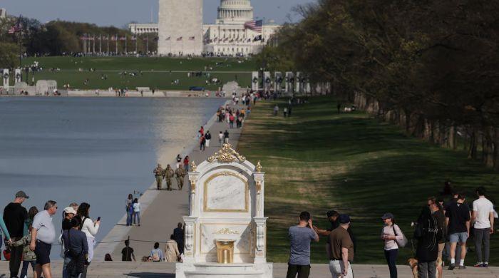 'A Throne Fit for a King': Golden toilet mocks Trump decor
