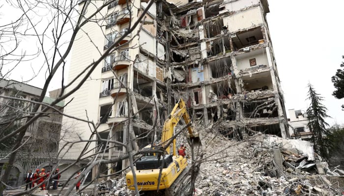 A view of a residential building damaged by a strike, amid the US-Israeli conflict with Iran, in Tehran, Iran, March 23, 2026. — Reuters